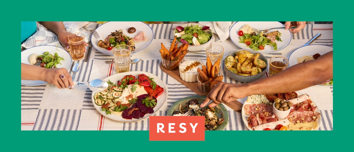 Two store associates reviewing a tablet