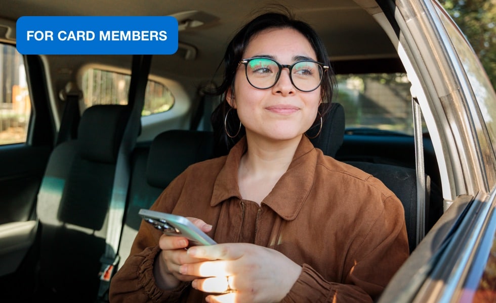 A Card Member using a device with an AI agent.