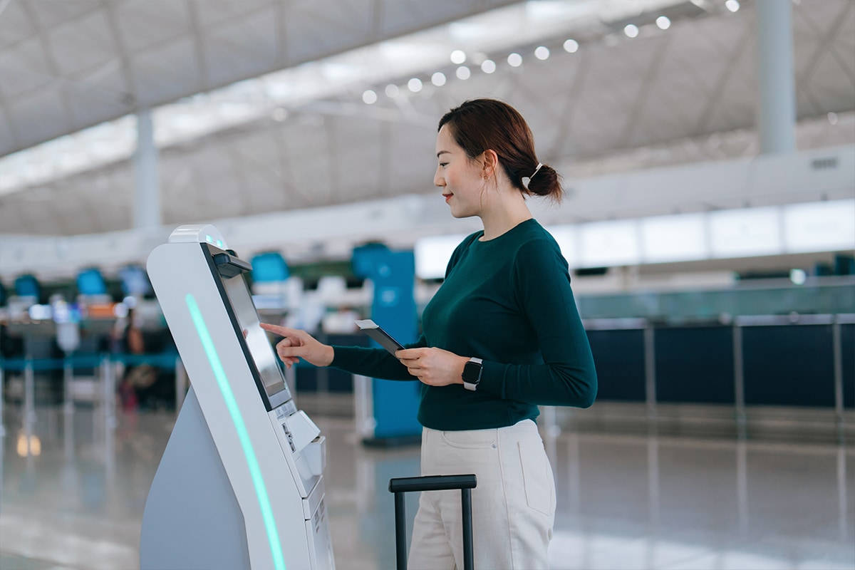 Someone with their luggage at baggage claim or check-in counter.