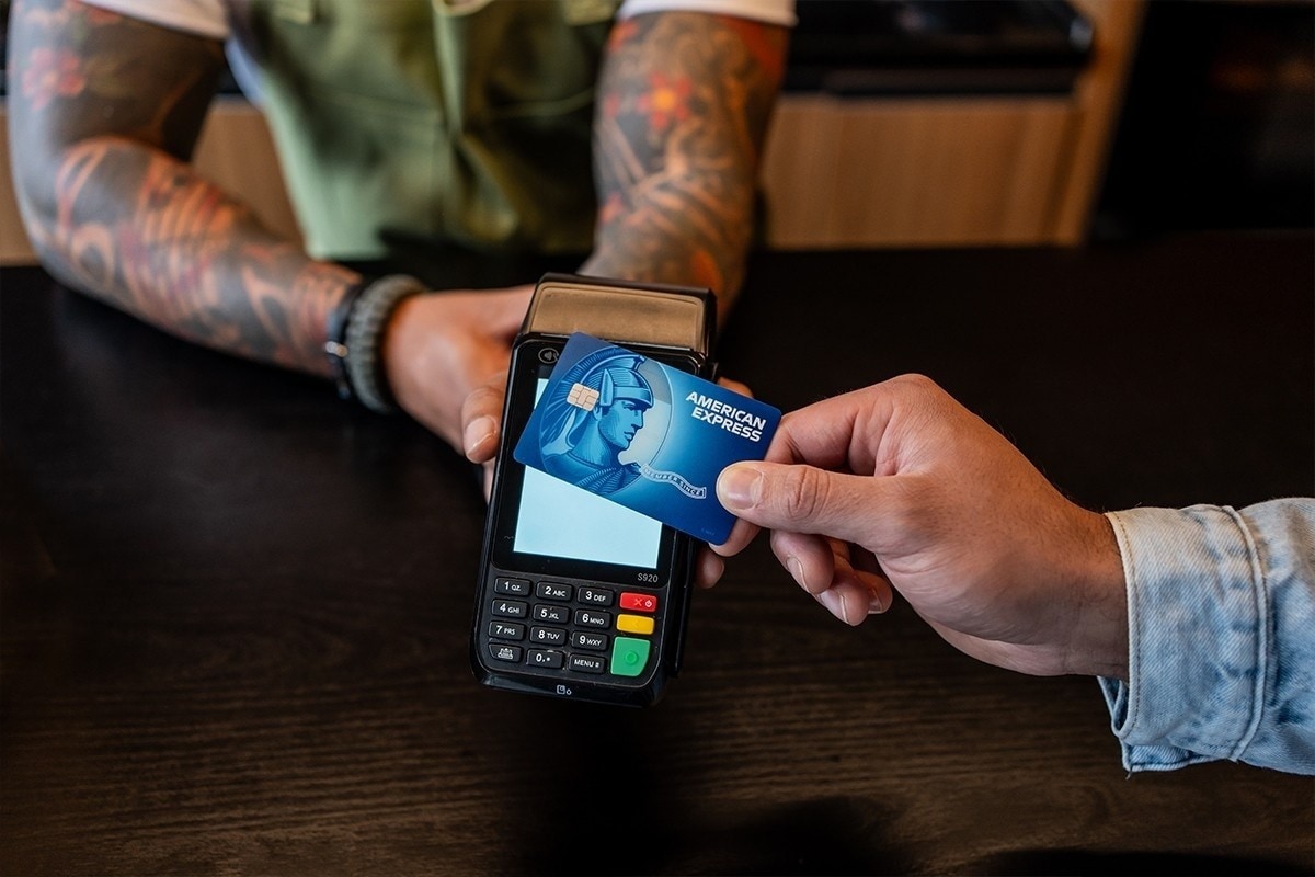 Someone looking at credit cards in a wallet.