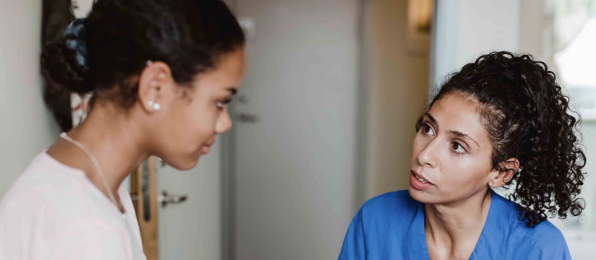 Person taking to a doctor in a doctor's office