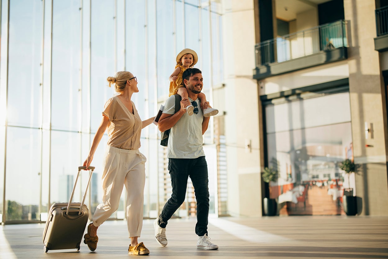 A family walking through an airport