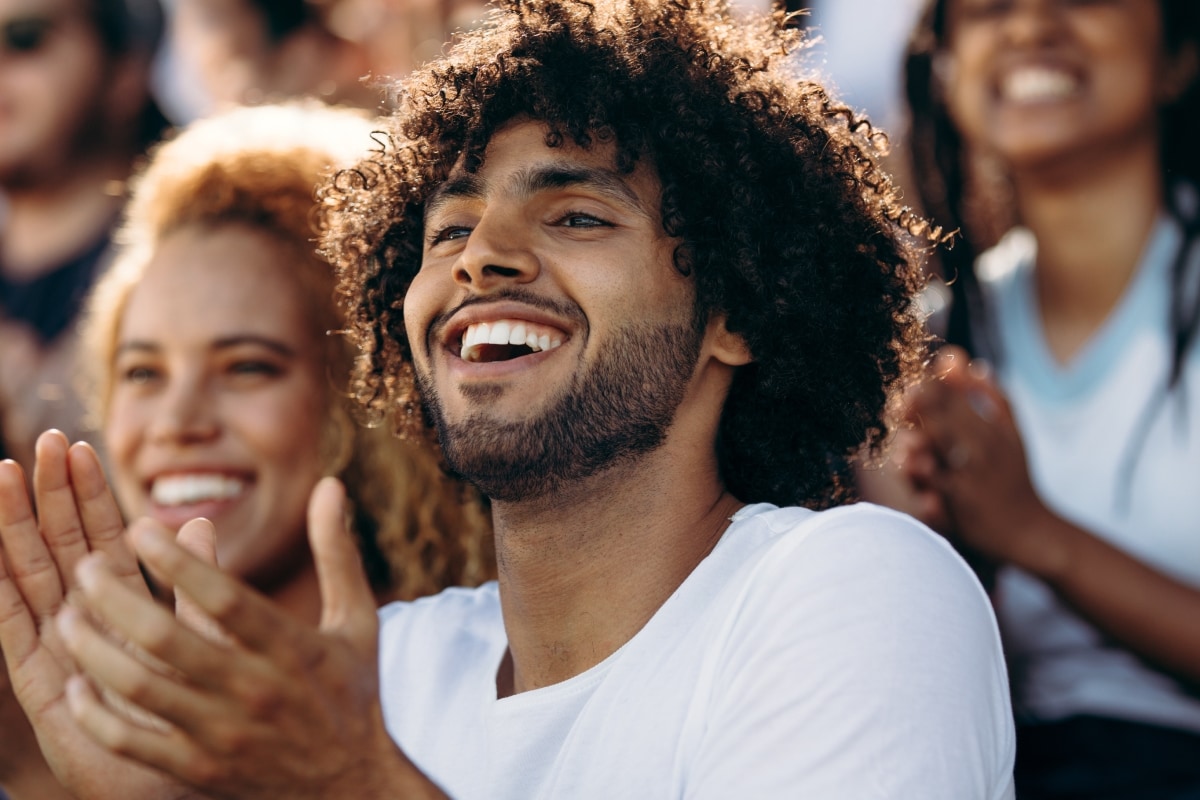 A couple cheering at a sports event