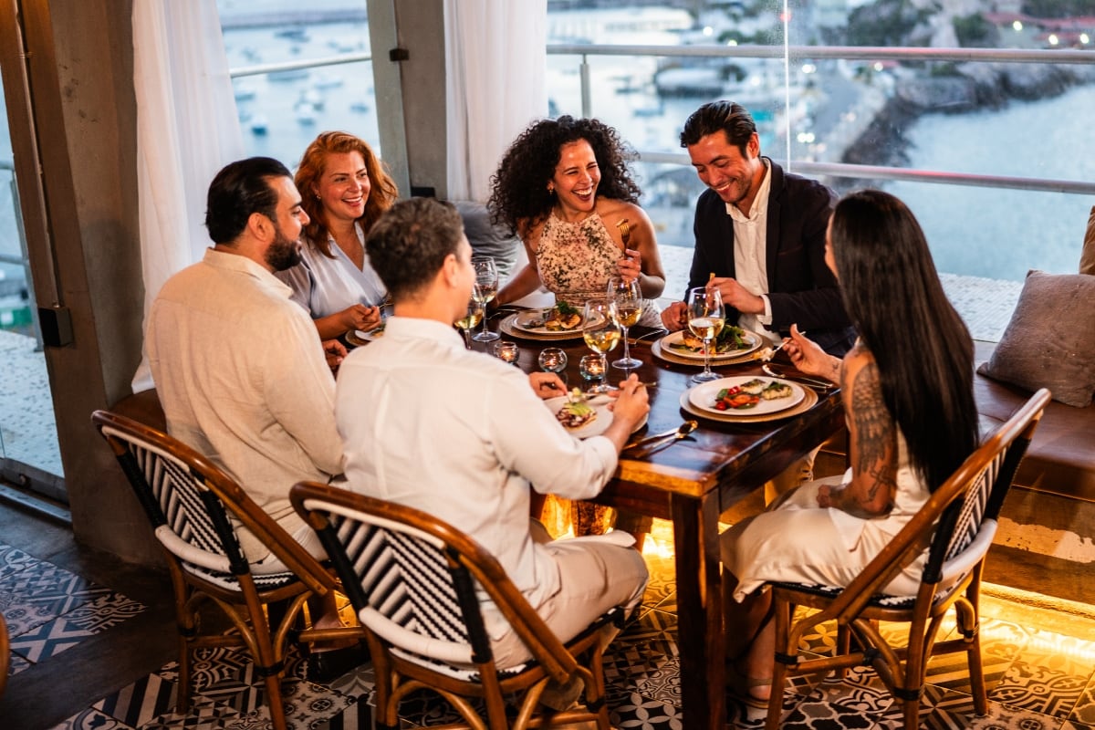 Someone dining with friends in an upscale restaurant