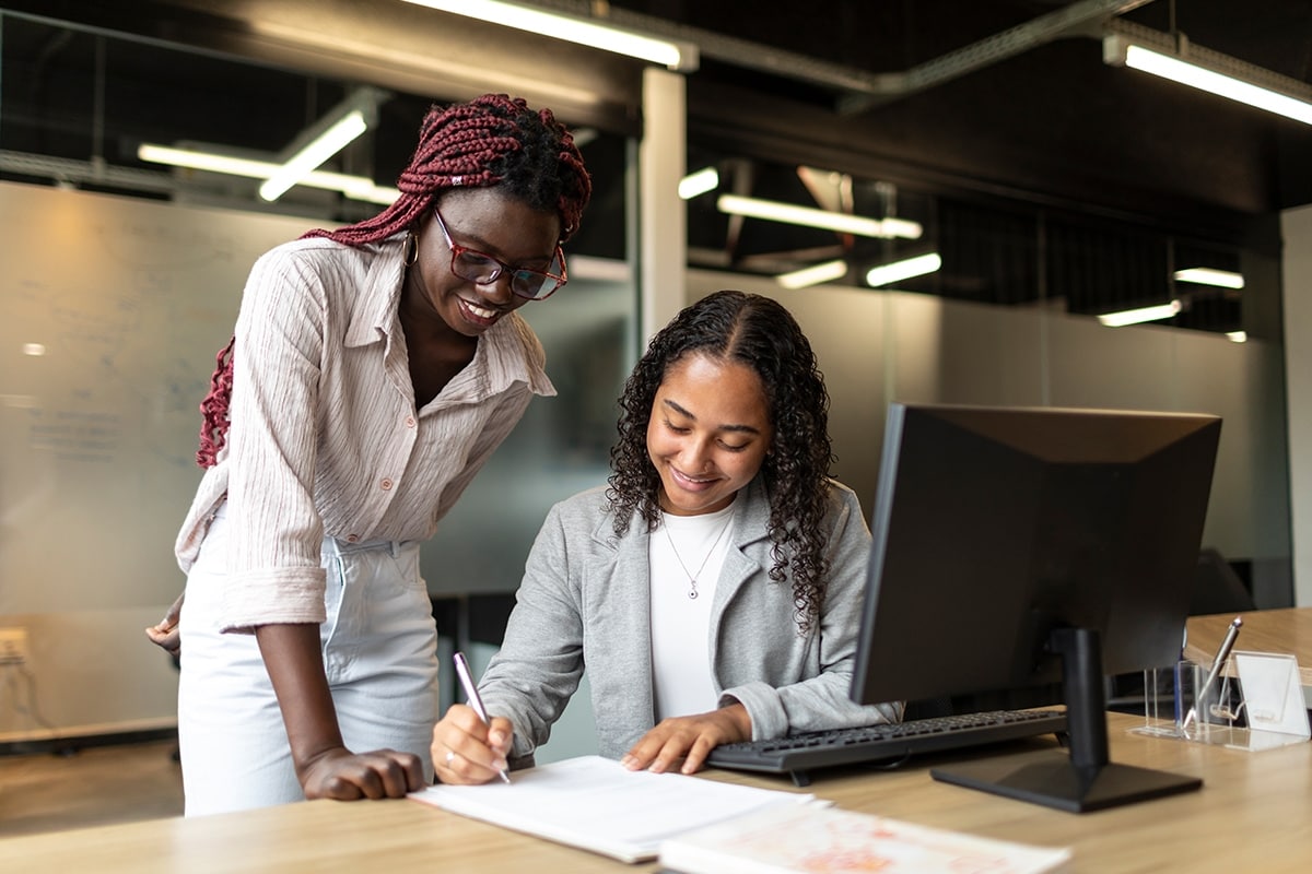 Someone signing a document