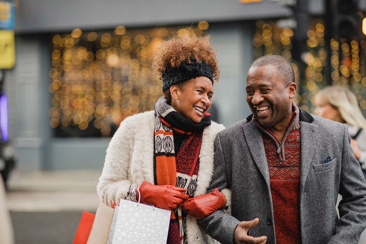Two people laughing after shopping