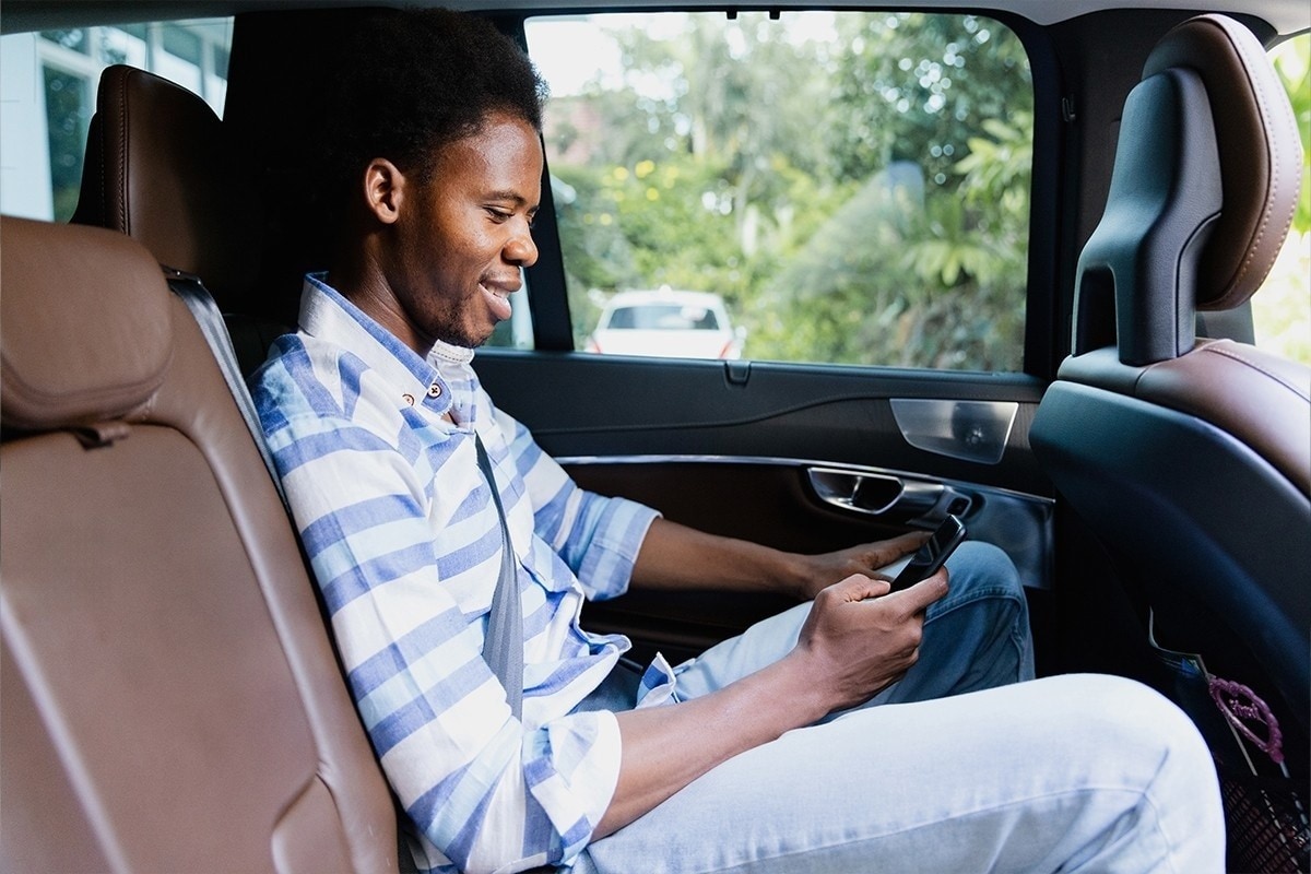 Someone getting into a rideshare car.