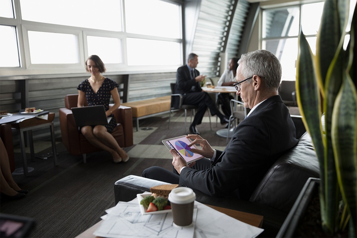 Someone analyzing financial charts on a tablet