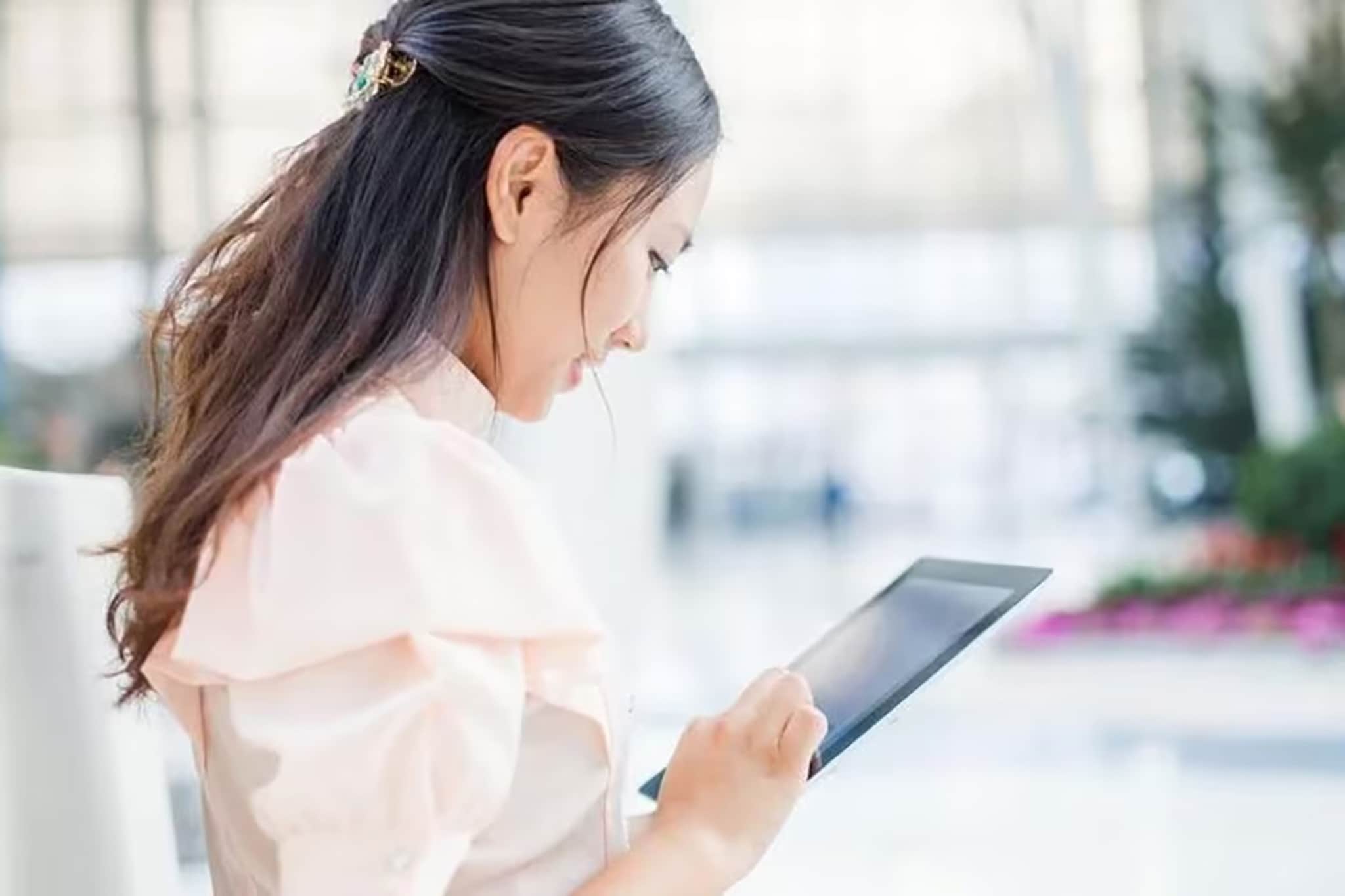 A woman uses her tablet
