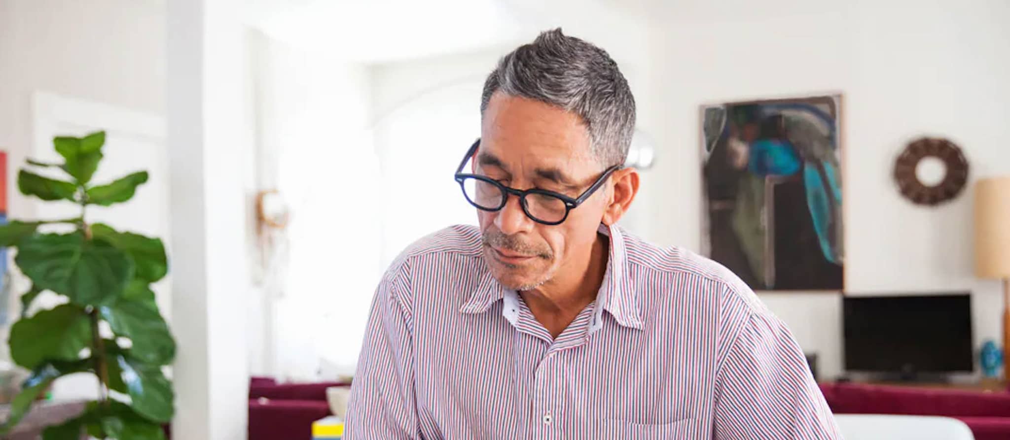 A man outlining details related to Identity Theft Protection by writing on paper.