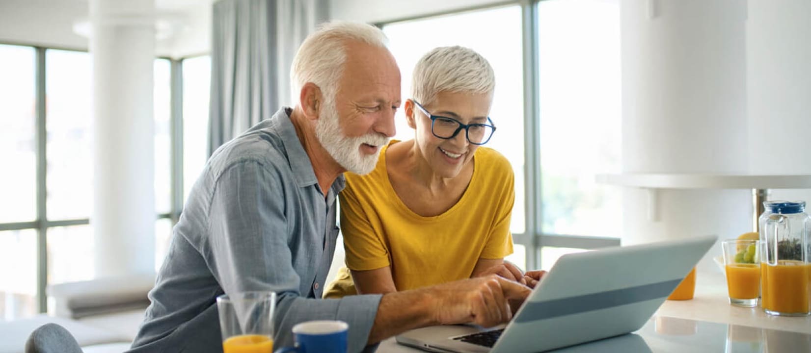 A retired couple discussing investment strategies with a financial adviser