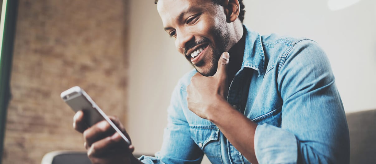 Someone using their smartphone while at home