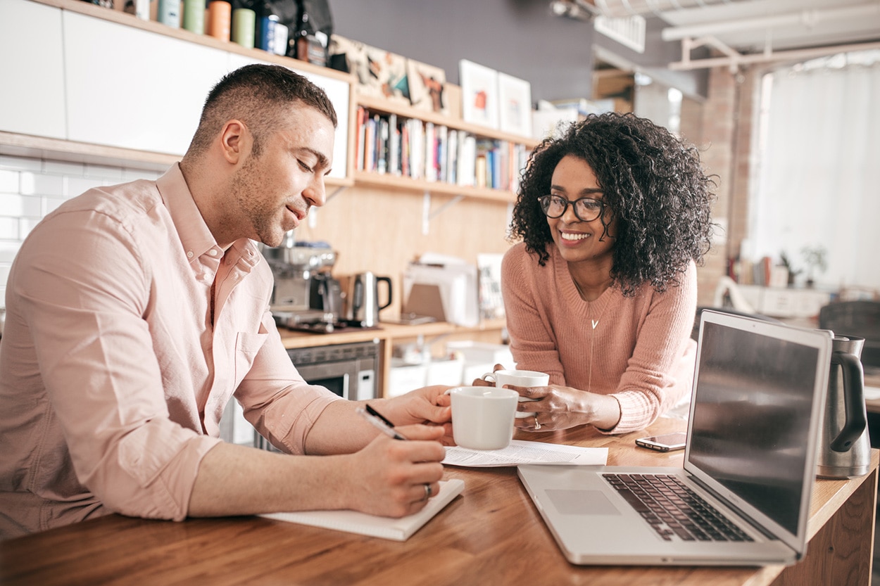 Two people talking business over coffee
