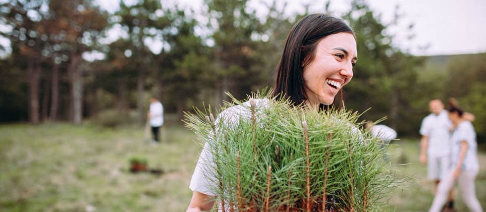 Woman holding a plant container