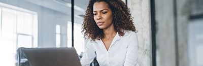 Lady in an office on a laptop