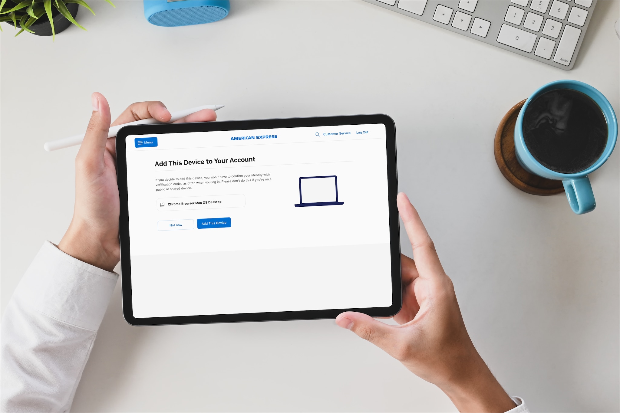 Man holding a tablet to review devices associated to an account