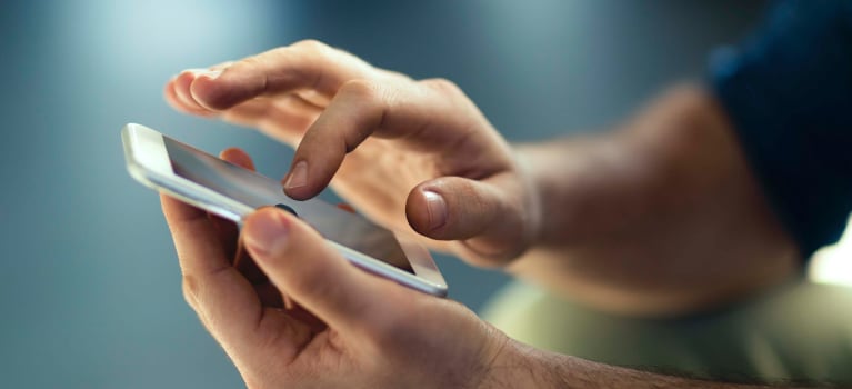 Hands using a mobile smart phone