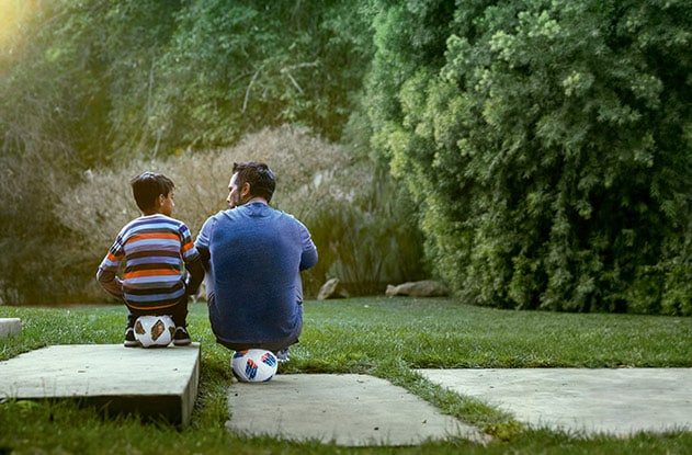 Father and son sitting