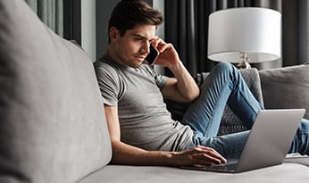 Man sitting outside on his latop