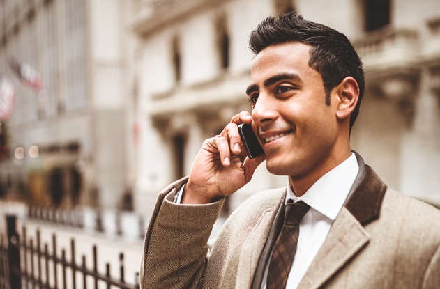 Two women chat in a furniture store.