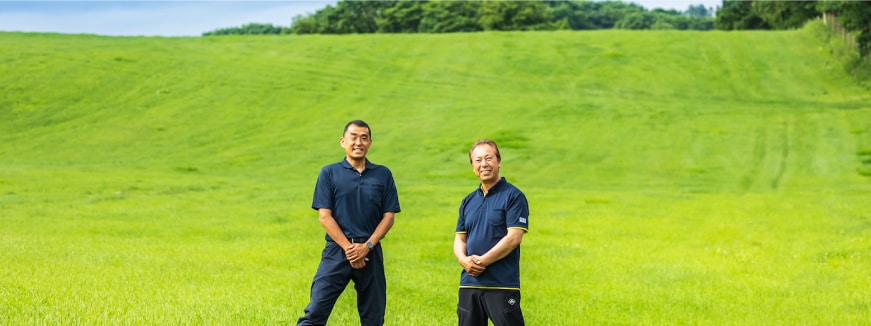 Japanese businessmen on green field