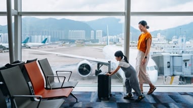 three women looking at hot air balloons