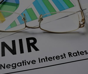 Know how business foreign currency exchange rates and risk management strategies are influenced by negative interest rates.