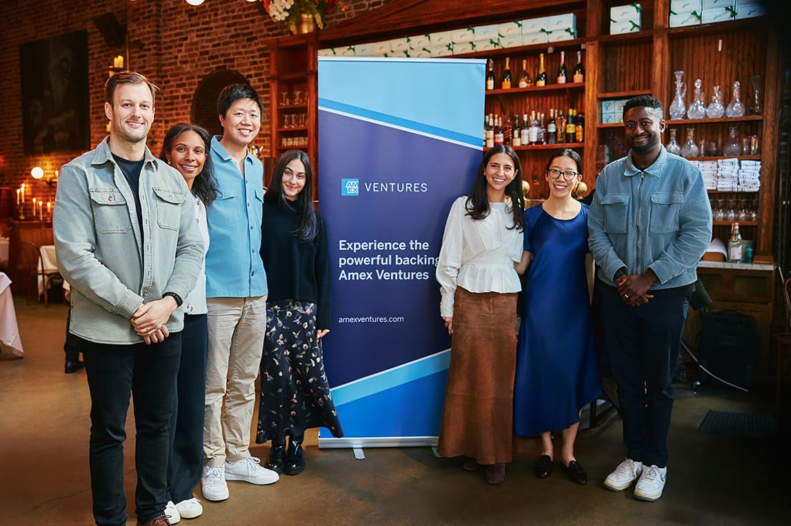 People in front of sign