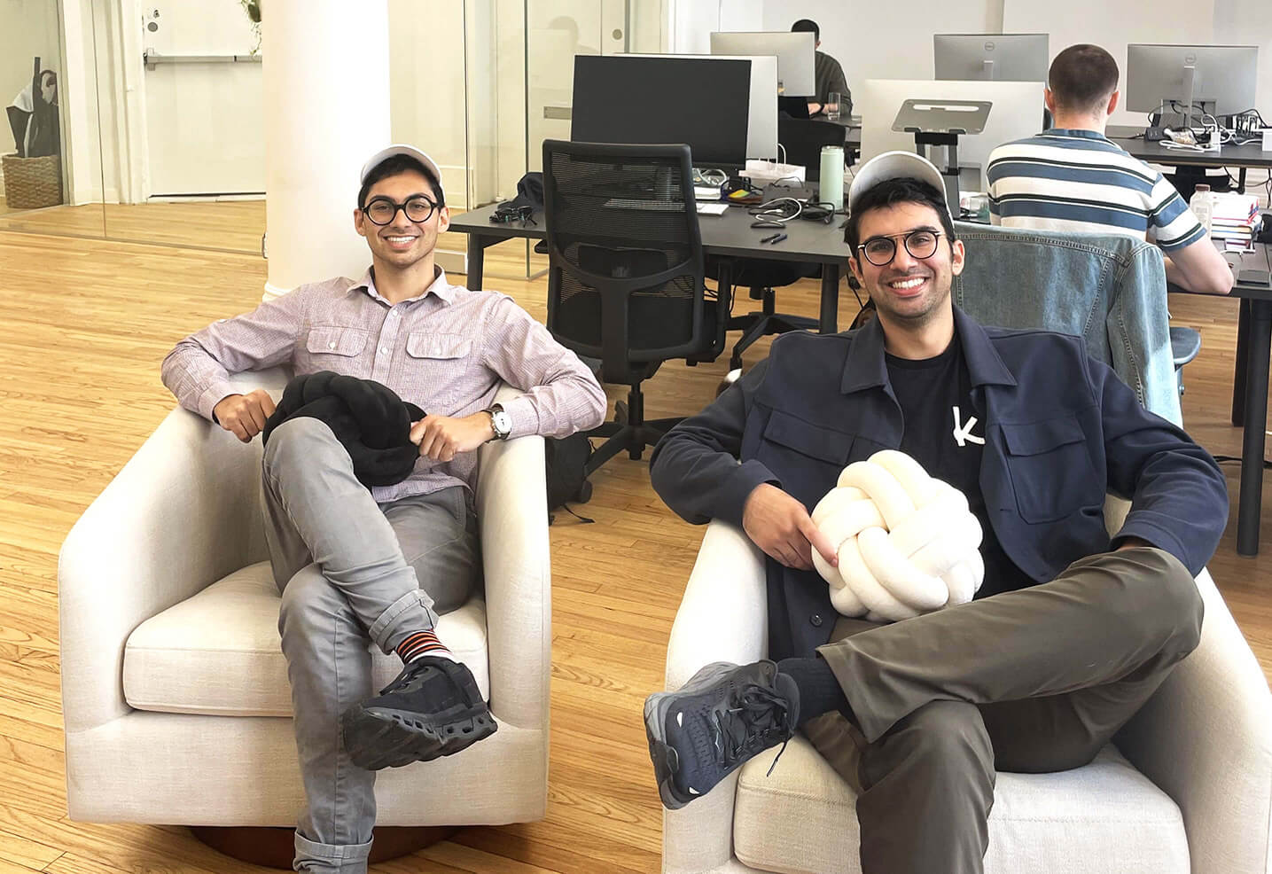 2 People on couch holding pillow