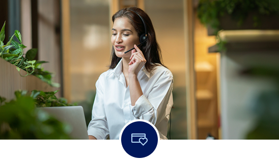Woman on a call, speaking into a headset.