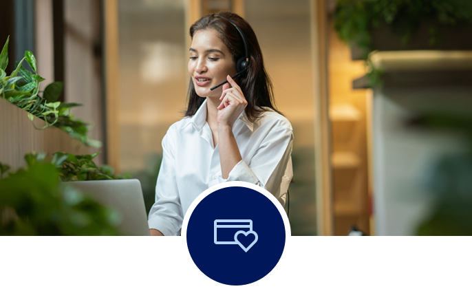 Woman on a call, speaking into a headset.