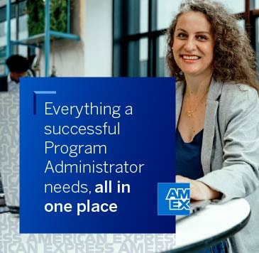 Smiling woman working on her laptop—American Express—Everything a successful Program Administrator needs, all in one place.