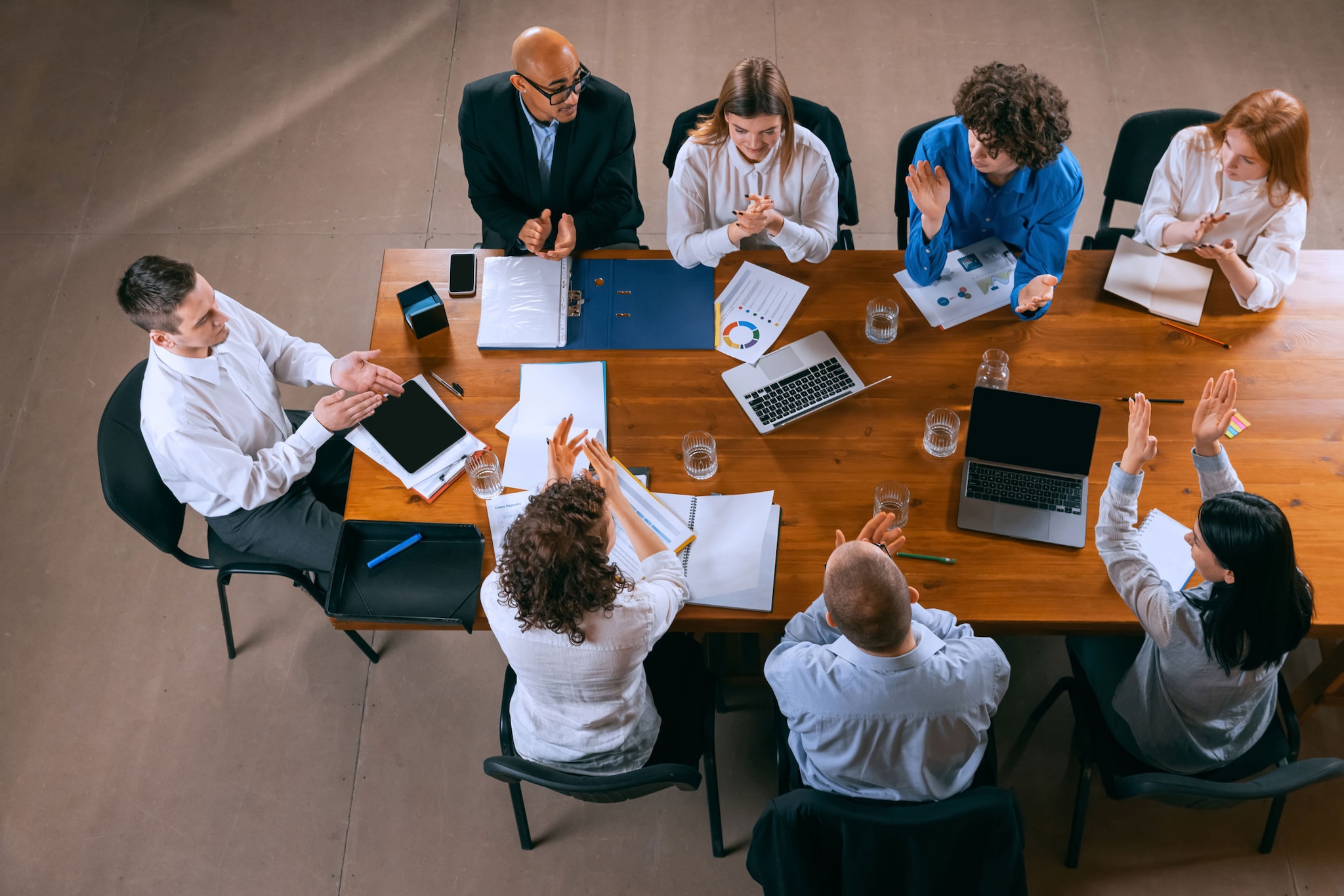 Top view of business conference, meeting, including young colleagues, co-workers, students during a work process at office.