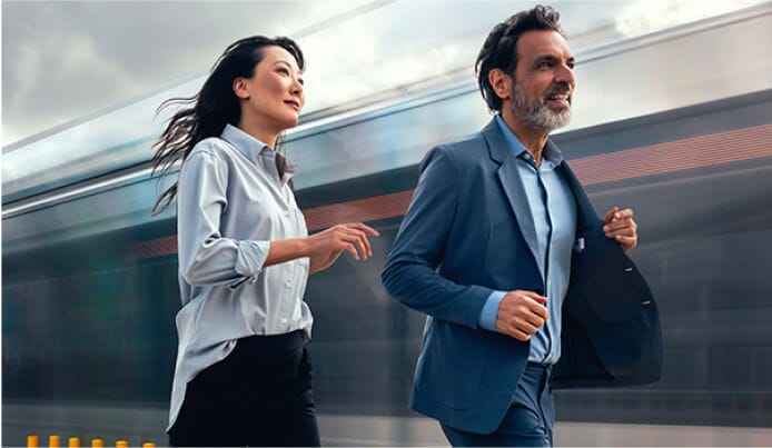 Two people walking swiftly