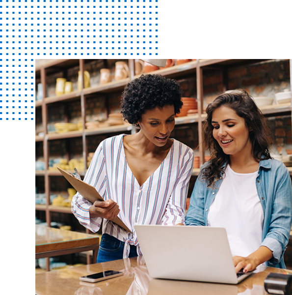 Two people looking at a laptop