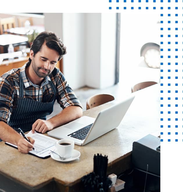 Small business owner writing a list