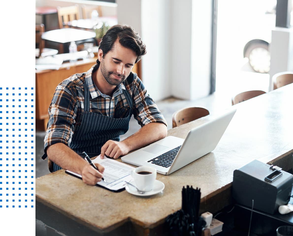 Small business owner writing a list