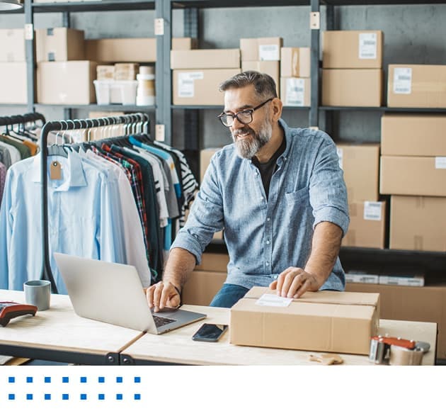 Person using a laptop to fulfill an order