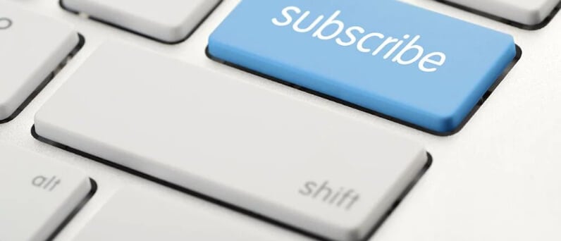 Graphic of white keyboard and blue subscribe button