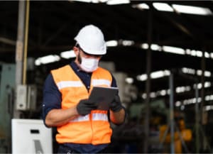 Construction worker looking at device