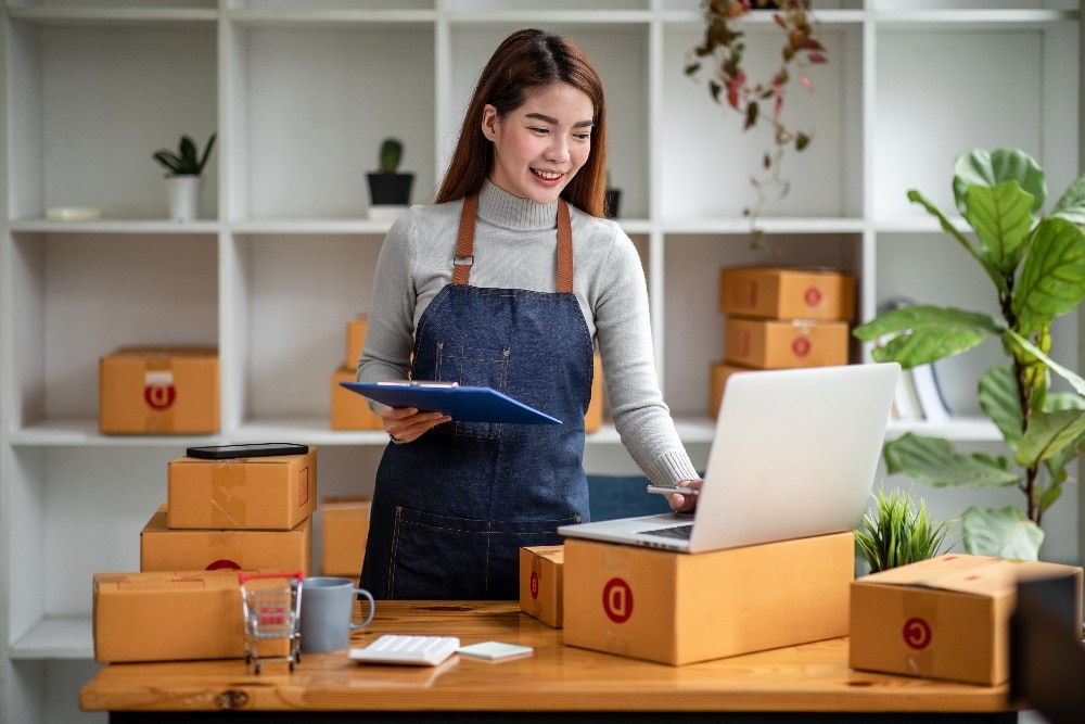 Person looking at glass window with post-it notes during brainstorming session