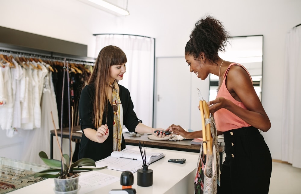 A woman checking out at a retail store