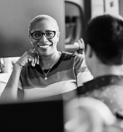 Image of a woman staring at another person smiling