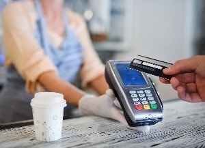 Person paying with contactless card