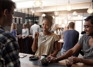 people at high table talking to each other