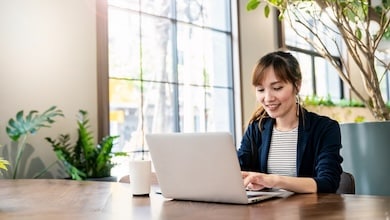 Woman sitting at desk with laptop