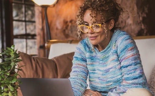 Woman looking at laptop