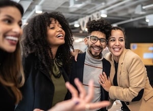 Four people standing together