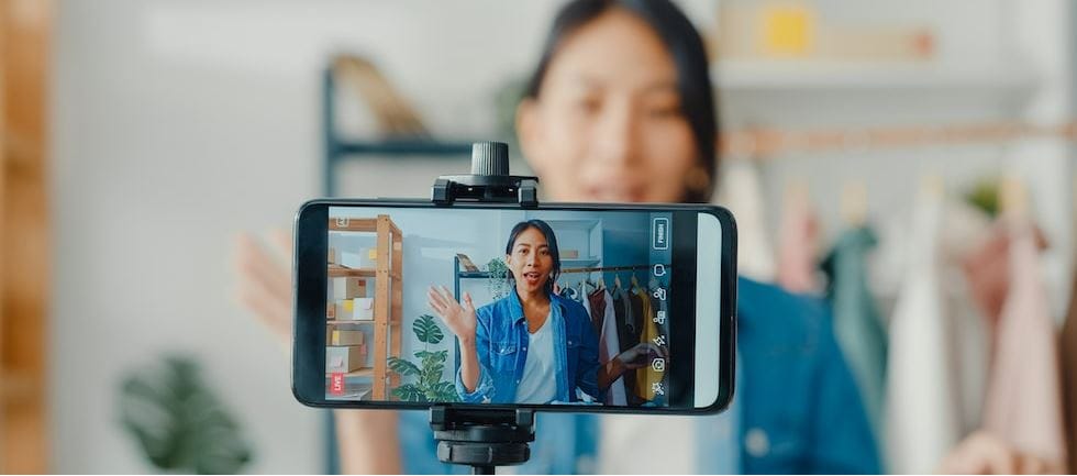 Business owner recording themselves to promote their business