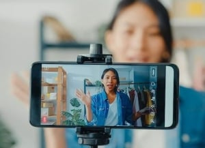 Business owner recording themselves to promote their business